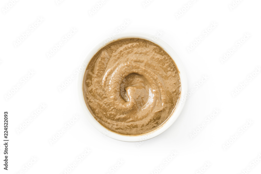 Tahini and sesame seeds isolated on white background. Top view - obrazy, fototapety, plakaty 