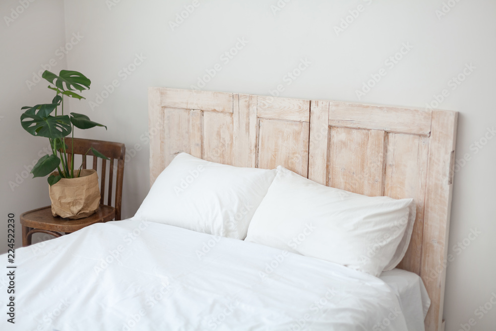 Scandinavian style bedroom. Succulent plant at the bed Scandinavian style bedroom. Succulent plant at the bed