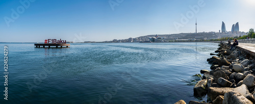 Formula 1 and F1 Baku Logo. Baku Flame Towers is the  tallest skyscraper in Baku. Panoramic view of skyline in Baku, Azerbaijan, with historic and modern architecture. Caspian Sea Panorama