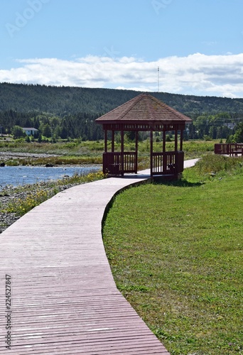 landscape along the the Baccalieu Trail;   wooden boardwalk and pavilion  along the shore at Harbour Grace harbor Conception Bay coastline, Avalon Peninsula Newfoundland and Labrador; Canada  photo