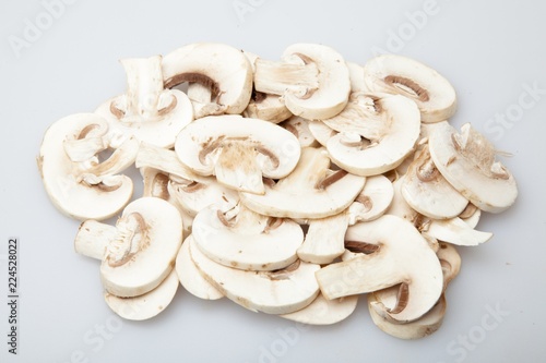 Sliced Champignons Mushrooms on Grey Background