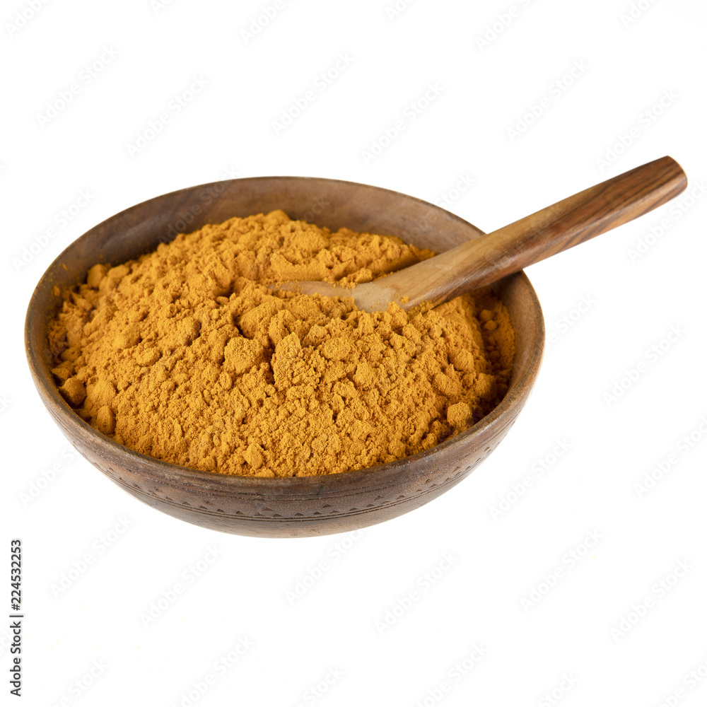 Turmeric Powder in Bowl with Spoon Turmeric Powder in Bowl with Spoon