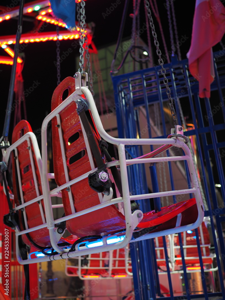 Seats of a merry-go-round ride.