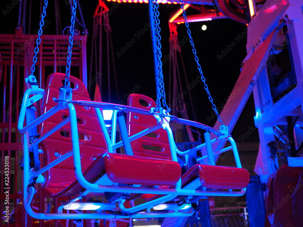 Seats of a merry-go-round ride.