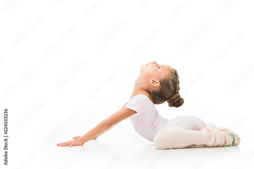 side view of little kid doing gymnastics exercises isolated on white background side view of little kid doing gymnastics exercises isolated on white background