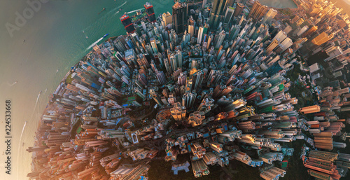 Little planet. Aerial view of Hong Kong Downtown. Financial district and business centers in smart city in Asia. Top view. Panorama of skyscraper and high-rise buildings. photo