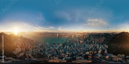 360 panorama by 180 degrees angle seamless panorama view of Downtown Hong Kong City at sunset. Skybox as background in equirectangular spherical equidistant projection for VR content photo