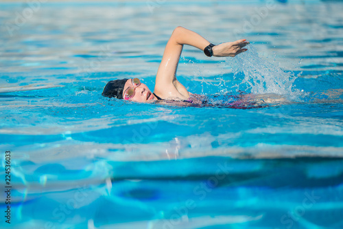 woman swimming in the swimming pool