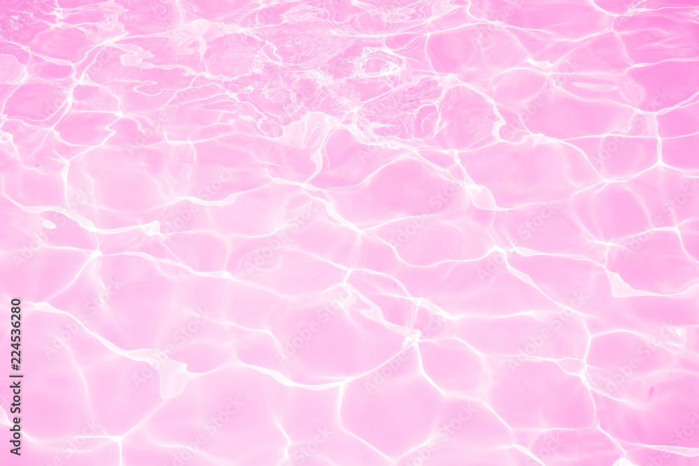 Beautiful pink water in swimming pool texture background Stock Photo