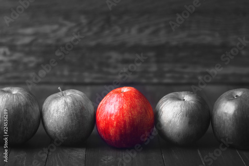 Right choice. Black and white photo with a red apple.