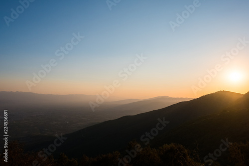 Sun Setting over Mountains