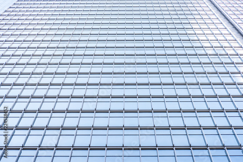 underside panoramic and perspective view to steel blue glass high rise building skyscrapers, business concept of successful industrial architecture