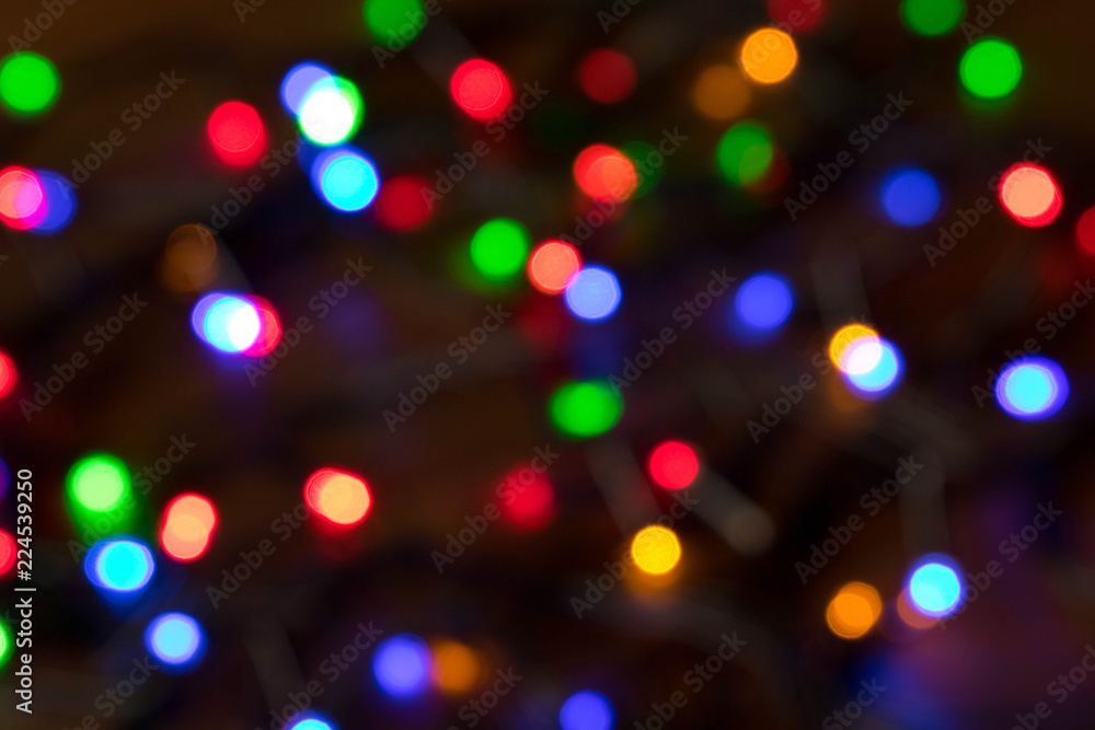 Blurred background of burning Christmas lights. Christmas and New year holidays concept Blurred background of burning Christmas lights. Christmas and New year holidays concept