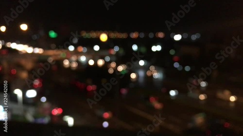 Closeup on colorful bokeh light create by moving traffic transportation at night.