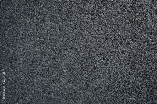 black or dark gray wall roughcast plaster background texture pattern photo