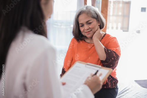 mature woman with neck hurt and feeling unwell photo