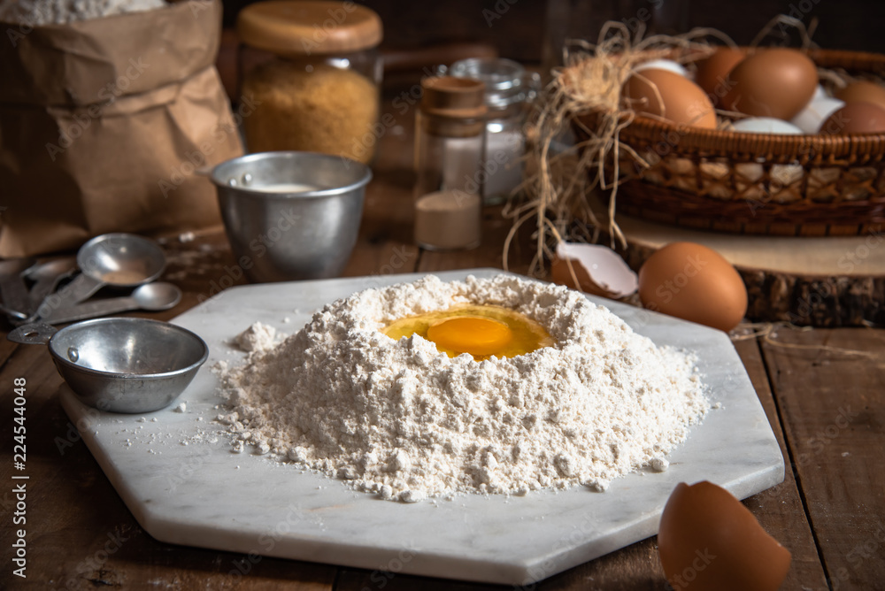 The ingredients for cakes and preparing material for making bread.In the atmosphere of farm and rural style. The ingredients for cakes and preparing material for making bread.In the atmosphere of farm and rural style.