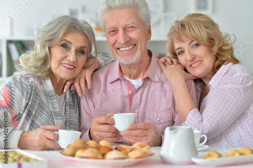 Portrait of senior people drinking tea at home