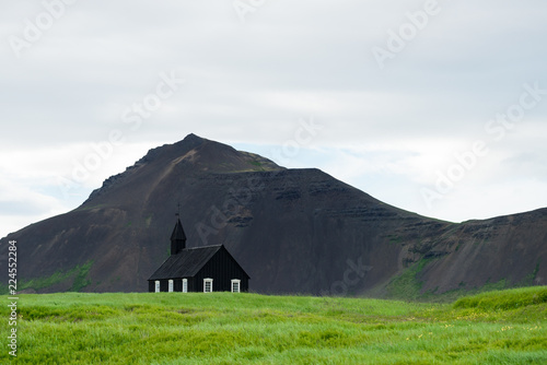 Budakirkja - black church in budir village photo