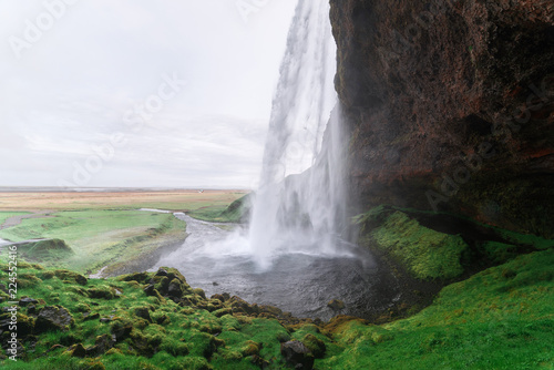 Seljalandsfoss waterfall and pathway around it  Iceland