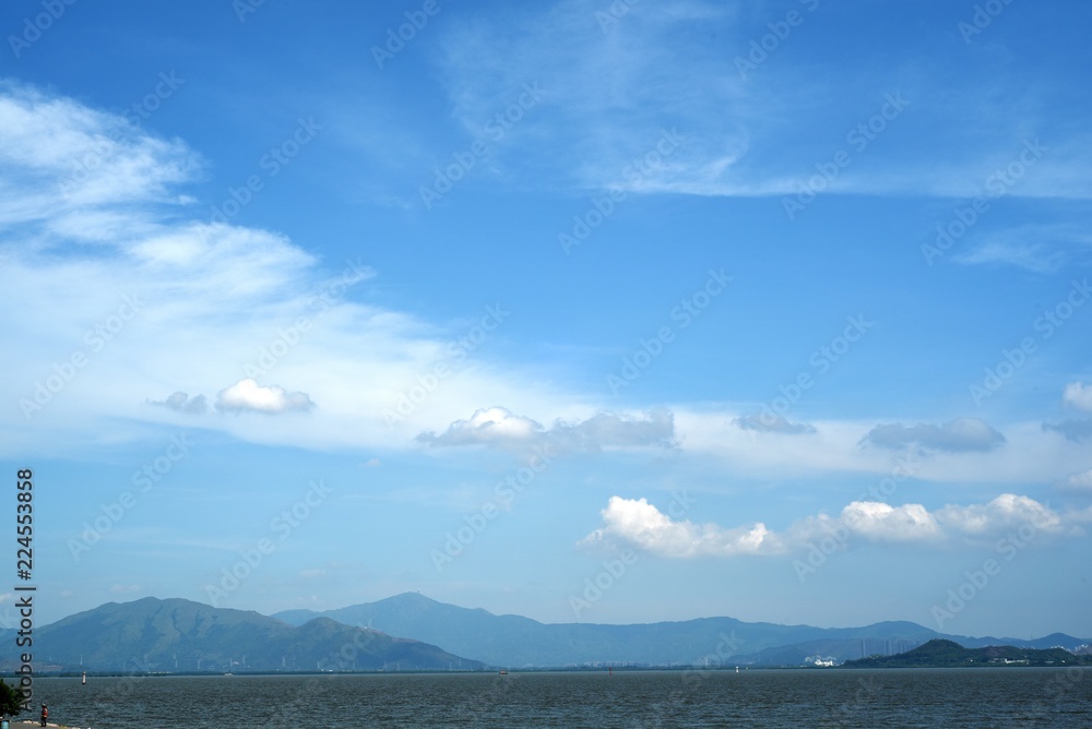 clouds over the sea at shenzhen bay, china
