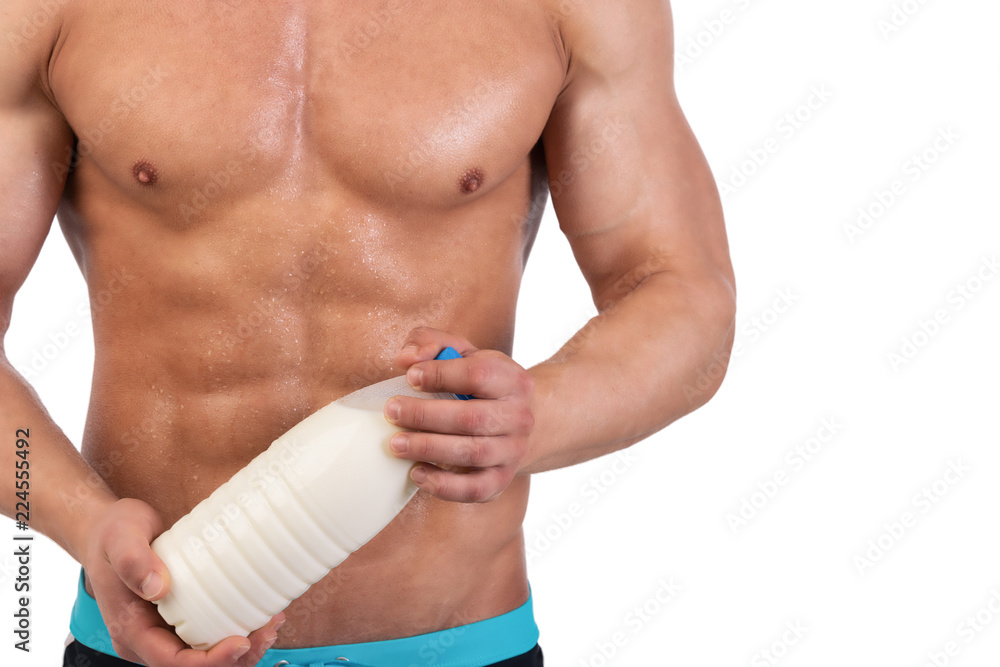 Naklejka premium Healthy lifestyle. An attractive man is drinking milk. 