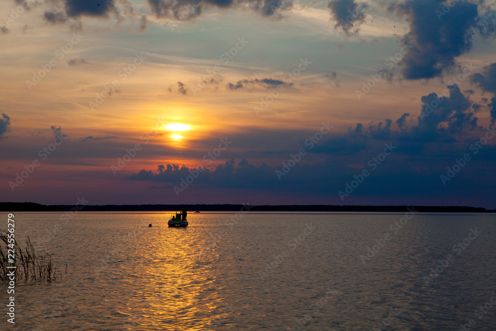 Beautiful summer sunset in the lake Svityaz. Sunset Background Beautiful summer sunset in the lake Svityaz. Sunset Background