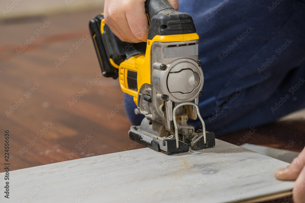 Person cutting floor panels Person cutting floor panels