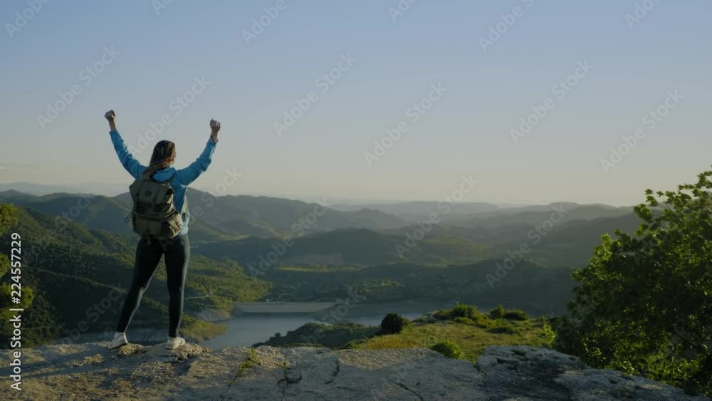 Female hiker on top of mountain Female hiker on top of mountain