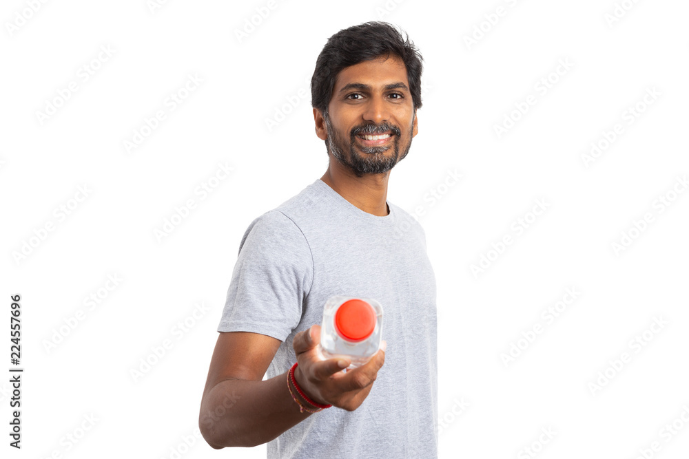 Indian man offering or presenting water bottle. Indian man offering or presenting water bottle.