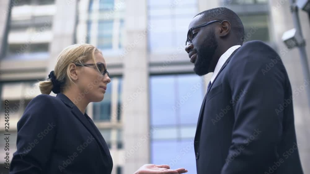 Female boss scolding subordinate, employee justifying himself, business ethics Female boss scolding subordinate, employee justifying himself, business ethics