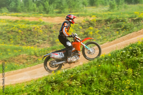 Fototapeta Naklejka Na Ścianę i Meble -  Motocross rider in the action