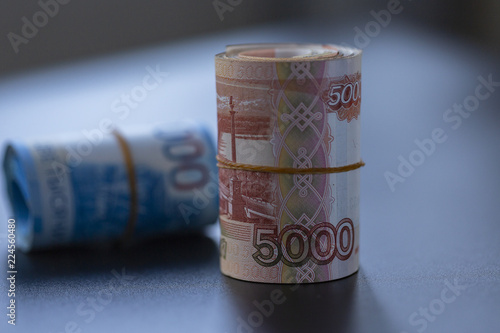 Russian banknotes on a black background. Close up. 
