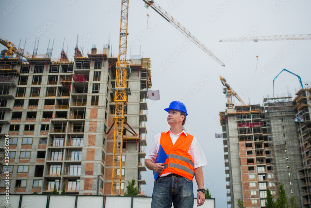Architect on a construction site during a housing project Architect on a construction site during a housing project