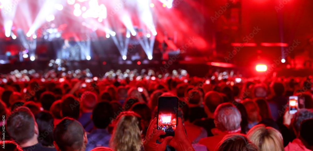 people with smart phone at live concert