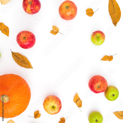 Fototapeta Naklejka Na Ścianę i Meble -  Autumn round frame of fall leaves, pine cones, apples and pumpkin on white background. Thanksgiving day. Flat lay, top view