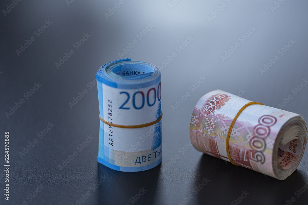 Russian banknotes on a black background. Close up. Russian banknotes on a black background. Close up.