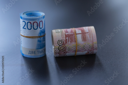 Russian banknotes on a black background. Close up. 