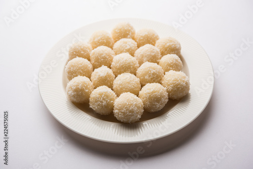 Coconut Sweet Laddoo OR Nariyal Ladduis a Popular Festival food from India. Served over moody background, selective focus