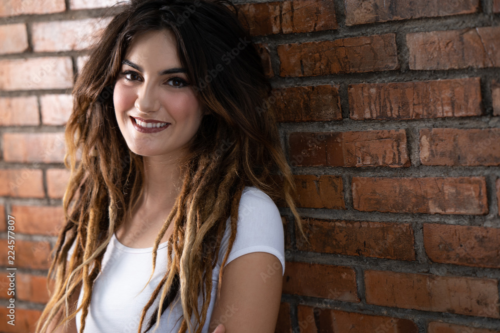 attractive young woman with dreadlock hair attractive young woman with dreadlock hair