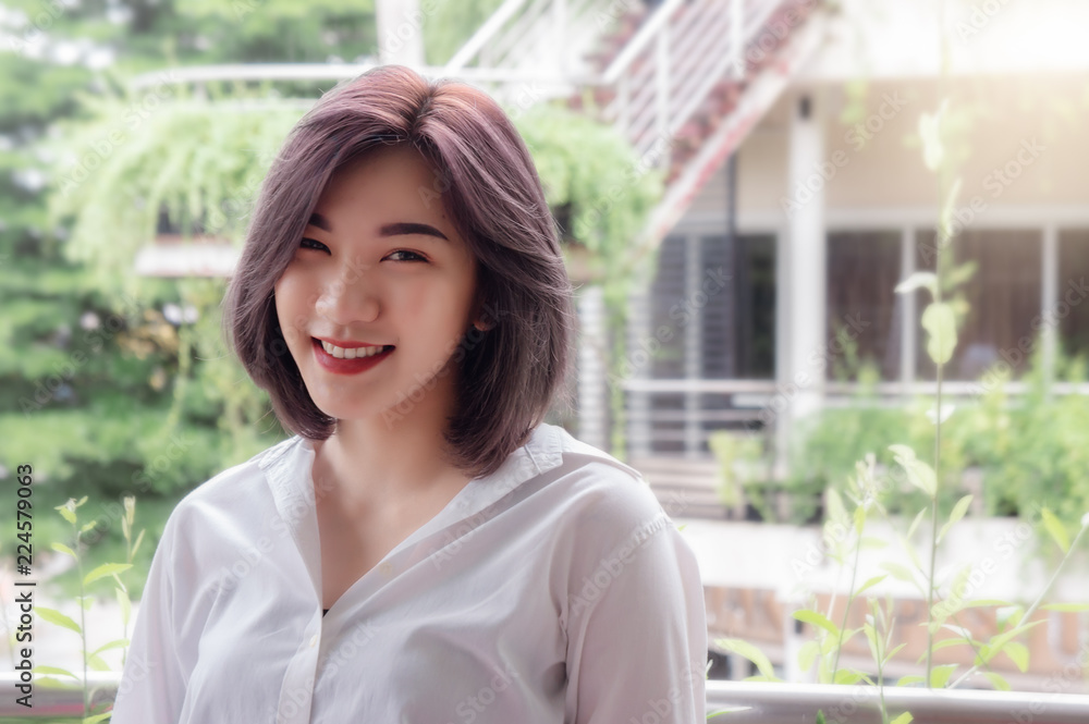 asain girl's smiling in the nature garden on the nice day asain girl's smiling in the nature garden on the nice day