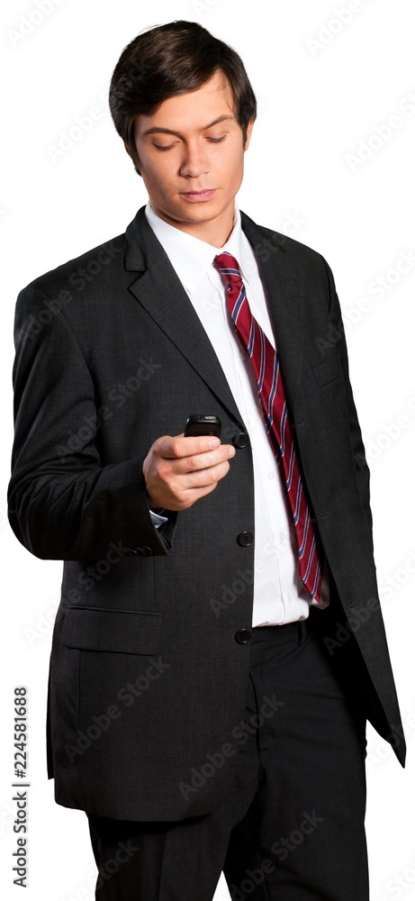 Businessman checking text on smart phone Businessman checking text on smart phone