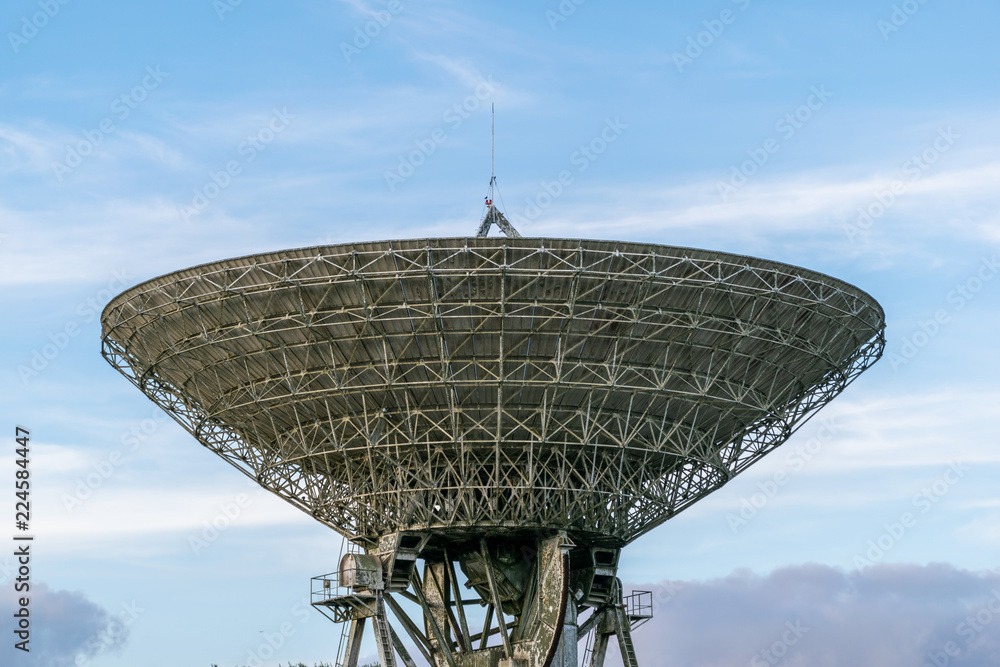 Parabolic antenna designed to receive electromagnetic signals from satellites, which transmit data transmissions or broadcasts, such as satellite television.