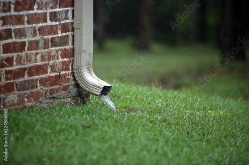 фотографія Gutter working during rain storm