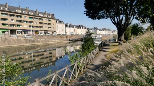 Reflection of the quay of the Sarthe river in Le Mans, a french city. It's located in the Pays de la Loire region, western France. photo