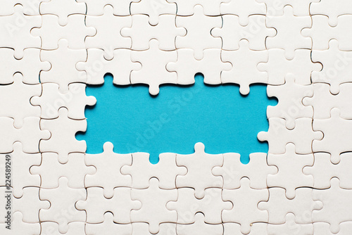 Canvastavla White details of puzzle on blue background and place for inscription