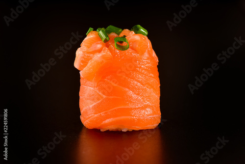 Joe sushi | Sushi wrapped on salmon slice photo