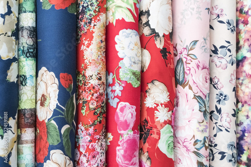 Fototapeta Naklejka Na Ścianę i Meble -  Samples of fabric - printed cotton of different colors on the display case