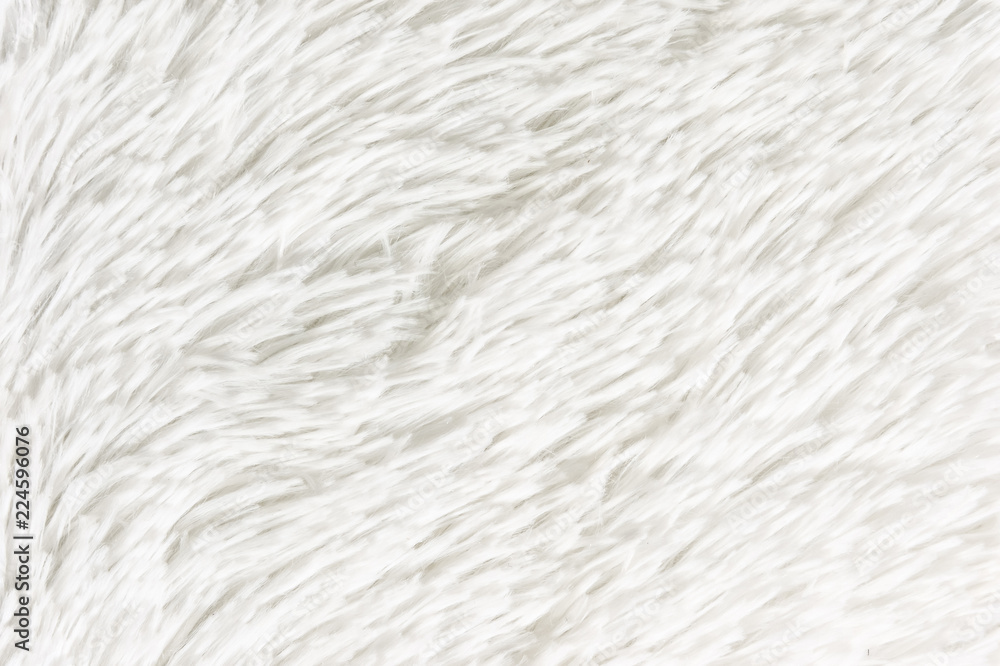 Fluffy plaid of polyester with a long heap gray. Comfortable home textiles. Background, texture Fluffy plaid of polyester with a long heap gray. Comfortable home textiles. Background, texture