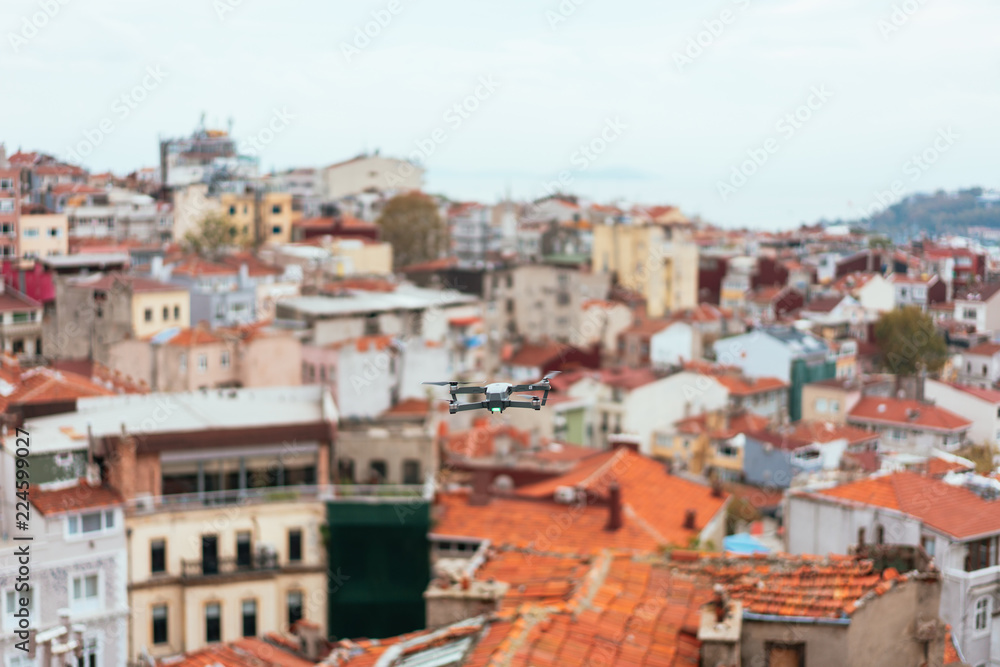 Drone flying above old city, selective focus